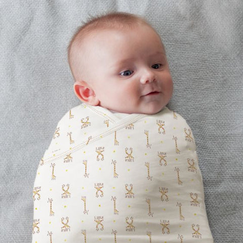 starry safari zen swaddle with giraffes