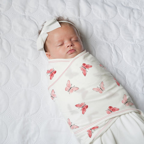 sleeping baby in swaddle 