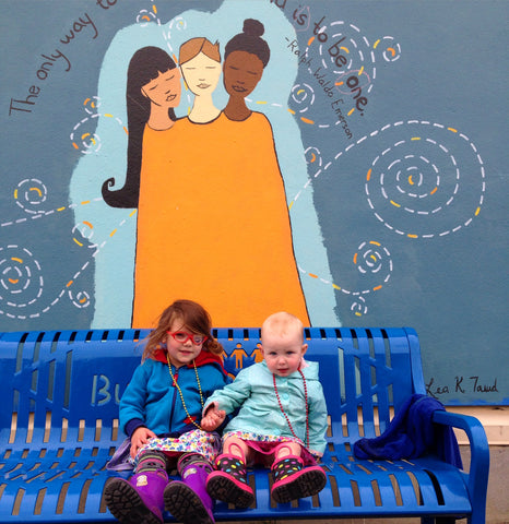 My daughter and her buddy on the bench in front of my mural