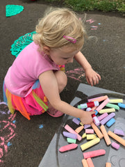 My daughter playing with sidewalk chalk