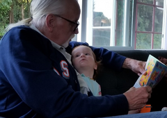 Dino-Buddies - Ed H reading with his beautiful new granddaughter, Lily