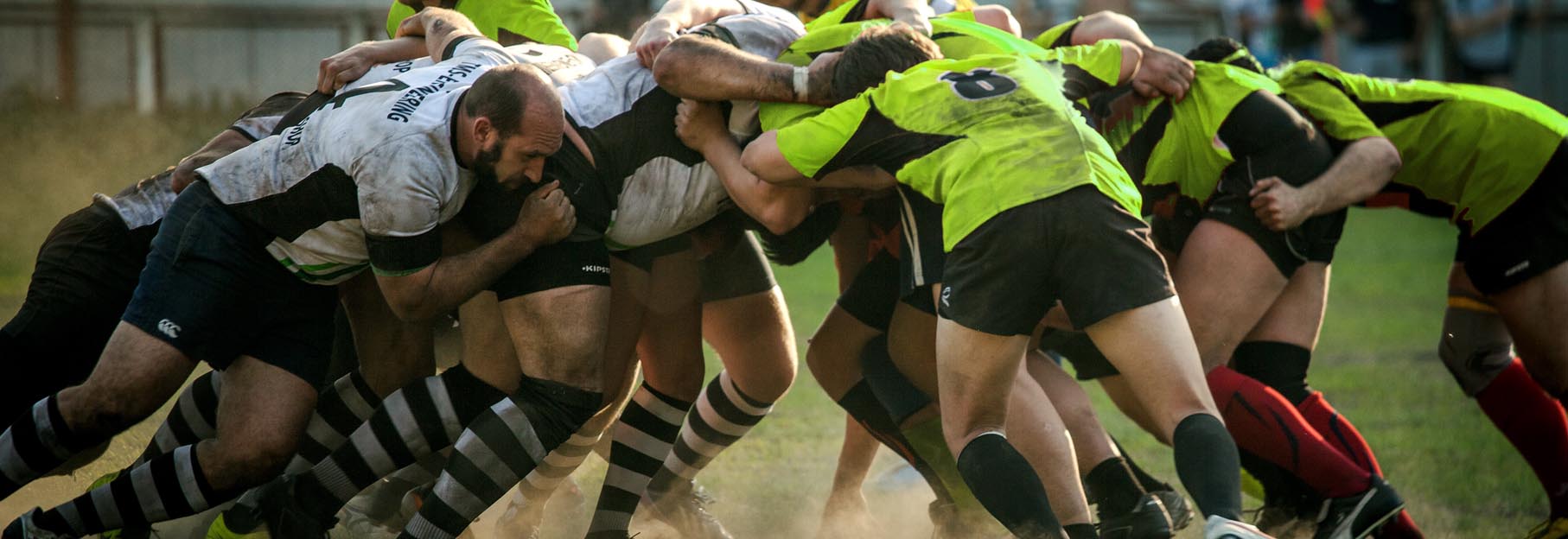 rugby players wearing a mouthguard during a game