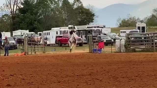 horseback rider entering a dirt ring