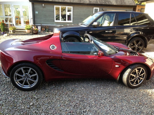 Elise with red stainless steel fuel cap surround bolts