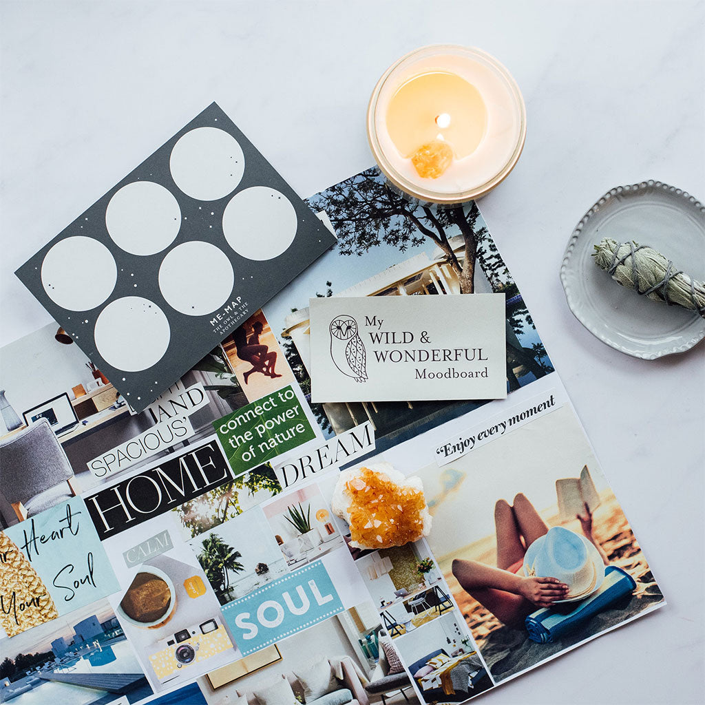 moodboard on table with candle and smudge stick