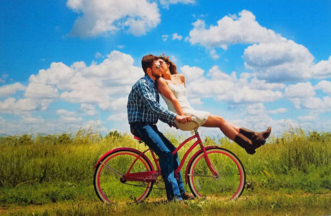 150 piece Wedding Guest Book Puzzle showing a couple riding a bicycle from their photograph