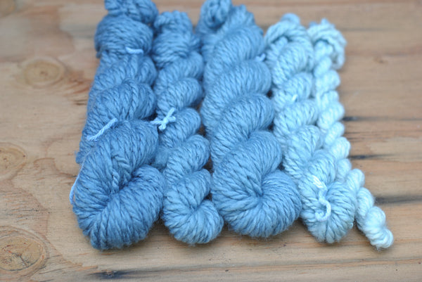 Gradient of indigo dyed mini skeins