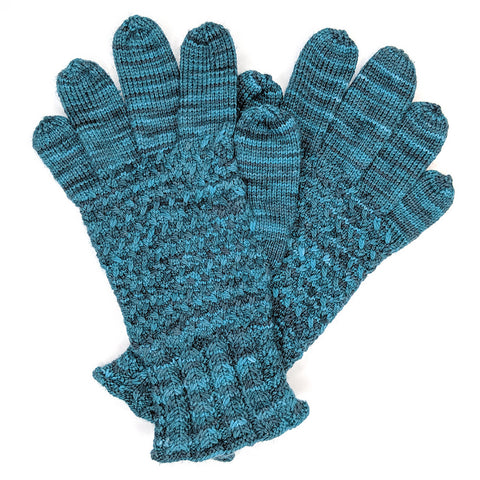 Lanark gloves knit in a teal variegated yarn
