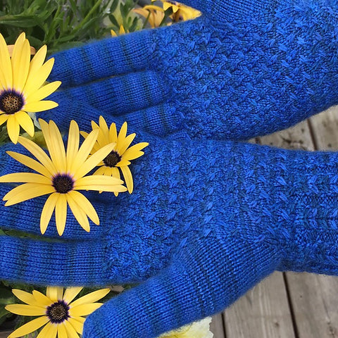 Bright blue Lanark gloves modeled with flowers