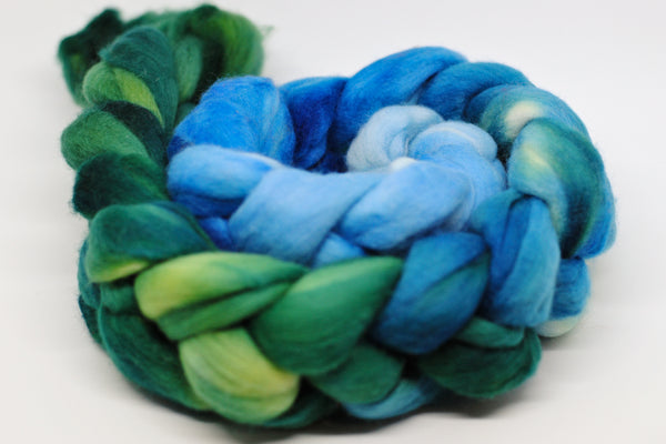 Coiled hand-dyed roving in blue-green gradient