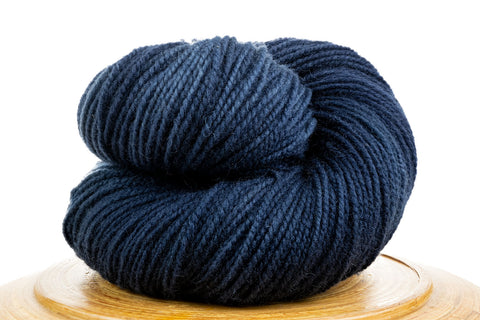 Winfield hand-dyed yarn in Dusk, a dark blue
