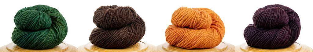 Row of 4 skeins of Winfield hand-dyed Canadian yarn