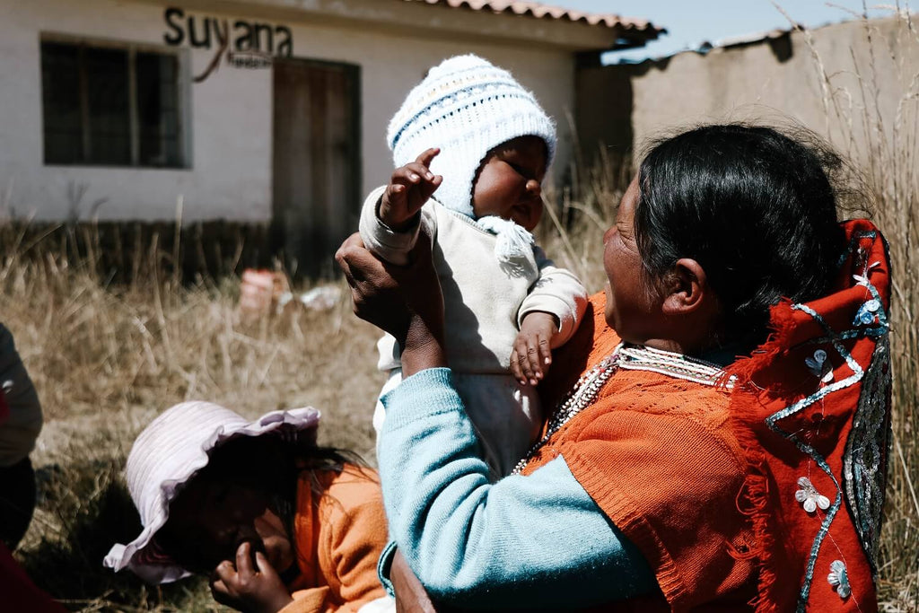 Peru artisan with baby