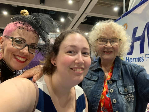 A selfie of Kaz (Mother Goth Rhymes), Sabrina (HP's Managing Editor), and Trina Robbins (Babes in Arms)!