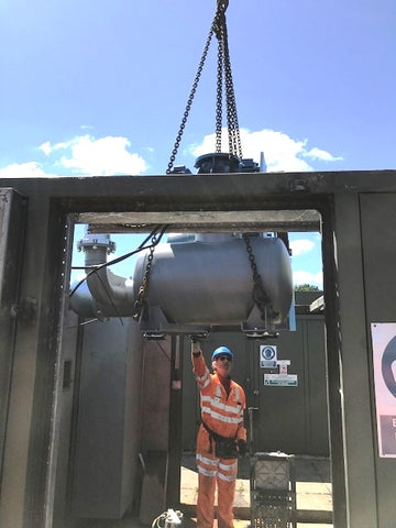 engineer lowering robuschi blower into place on site 