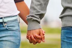 couple holding hands image