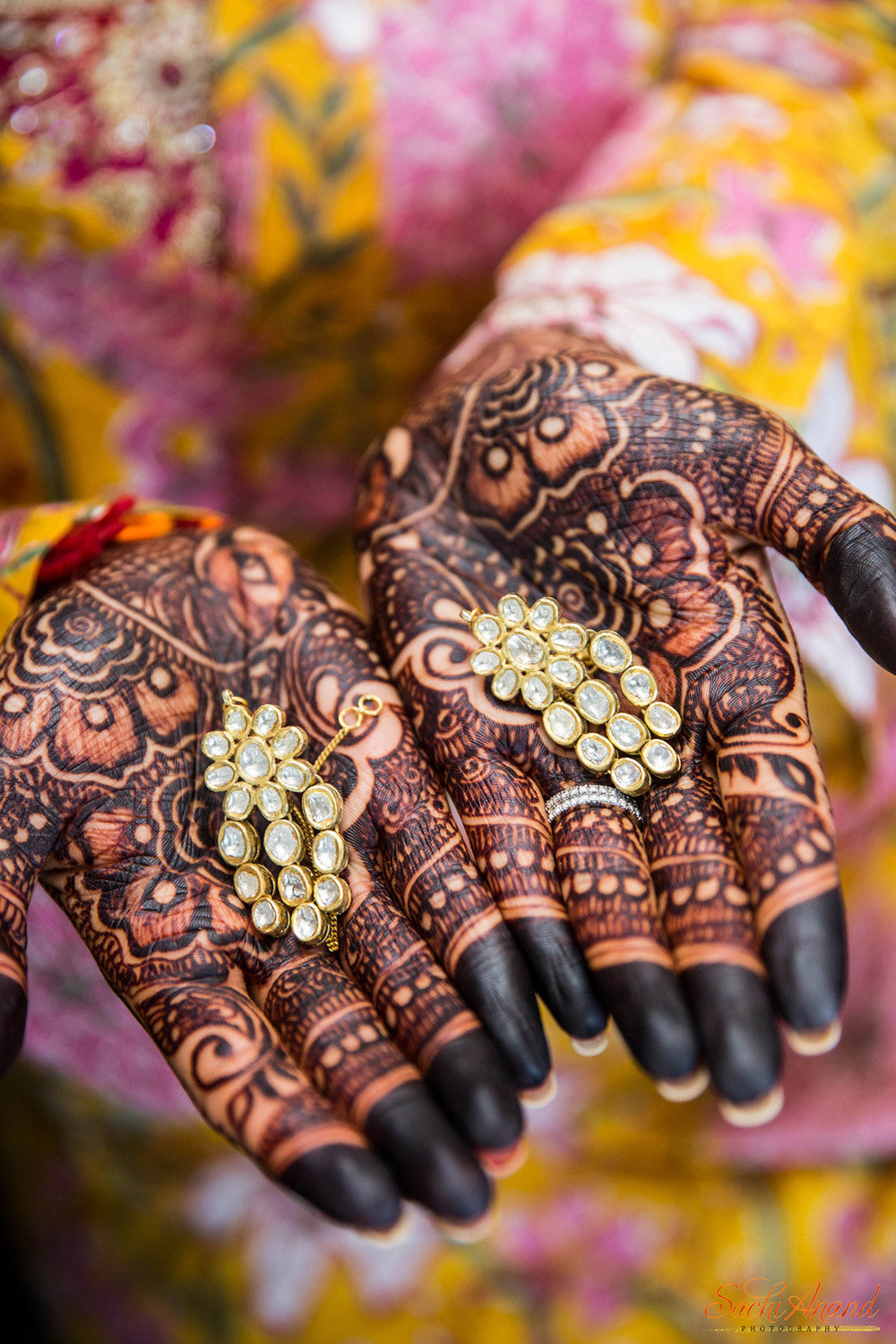 bride mehndi hands with jewelry