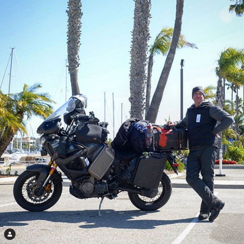 Cannonball Run rider Adam Frasca in Redondo Beach, California at the end of his world record ride.