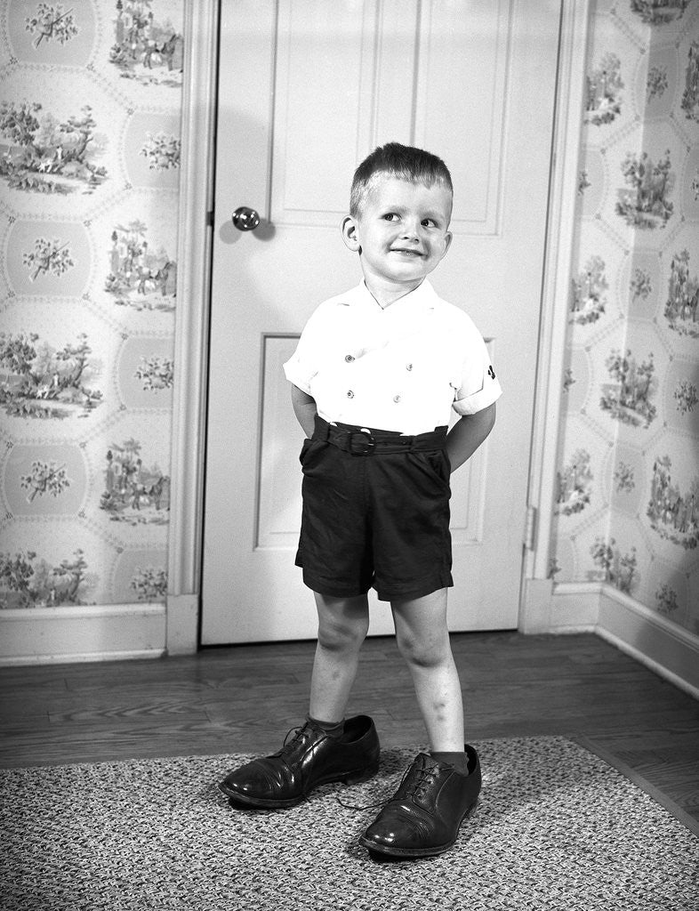 Detail of Boy Wearing Men's Shoes by Corbis