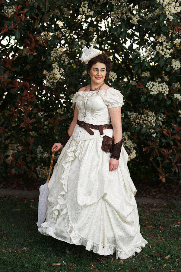 Melissa chose an ivory victorian bridal gown with tight lacing corset