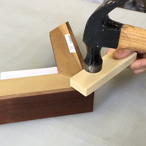 Use a piece of wood to in between the hammer and the dovetail