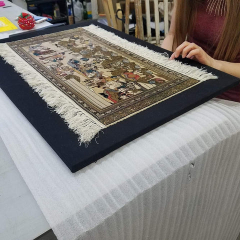 Frames and Stretchers framing an antique tapestry using complex sewing techniques.