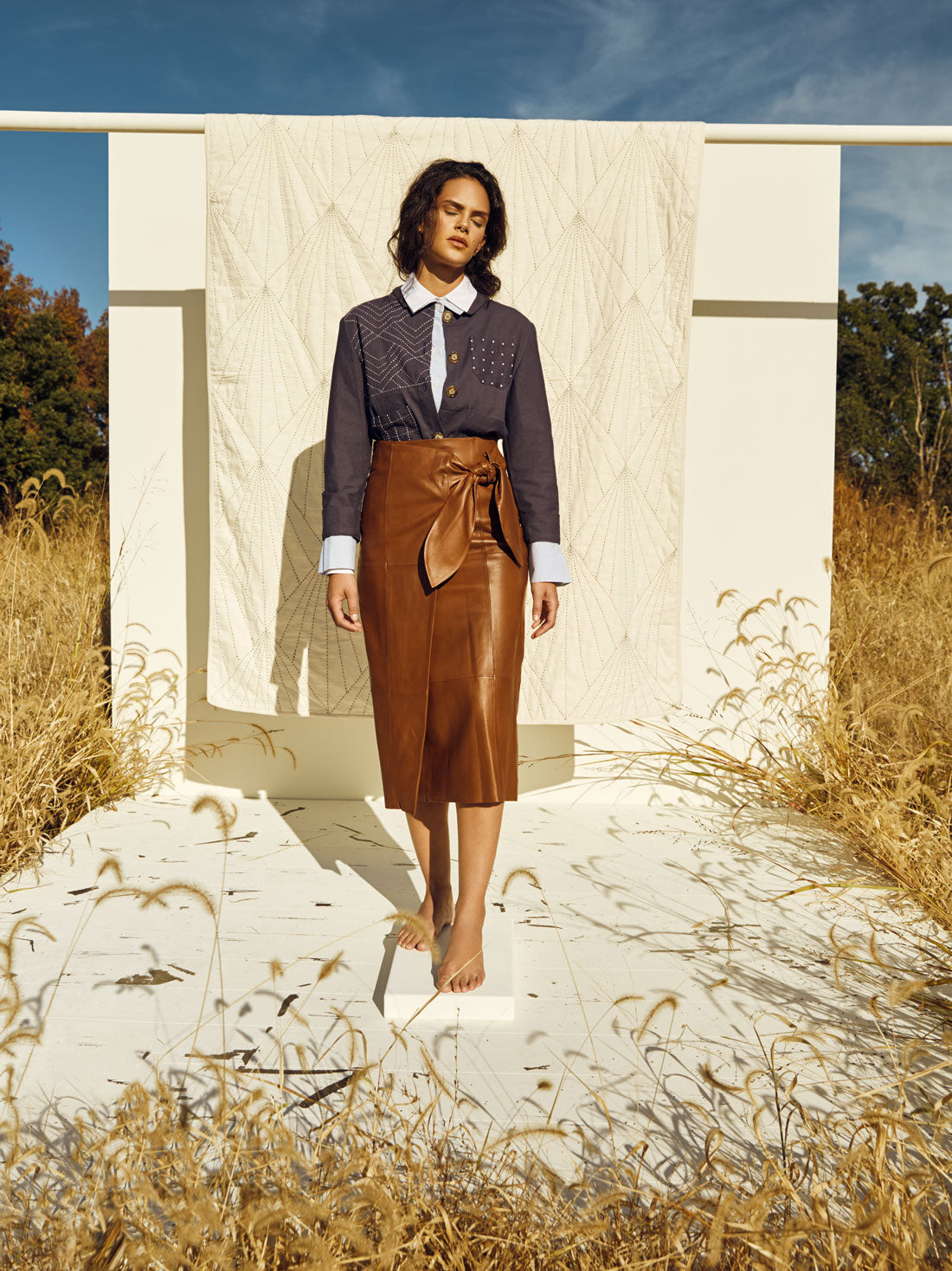 Anchal Navy Chore Jacket with Array Quilt in a Kentucky field, photographer Clay Cook