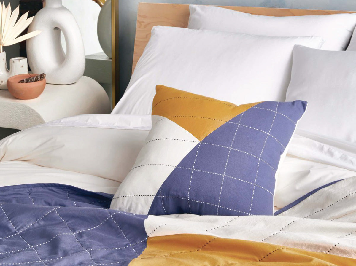 Anchal x Brooklinen patchwork mustard pillow