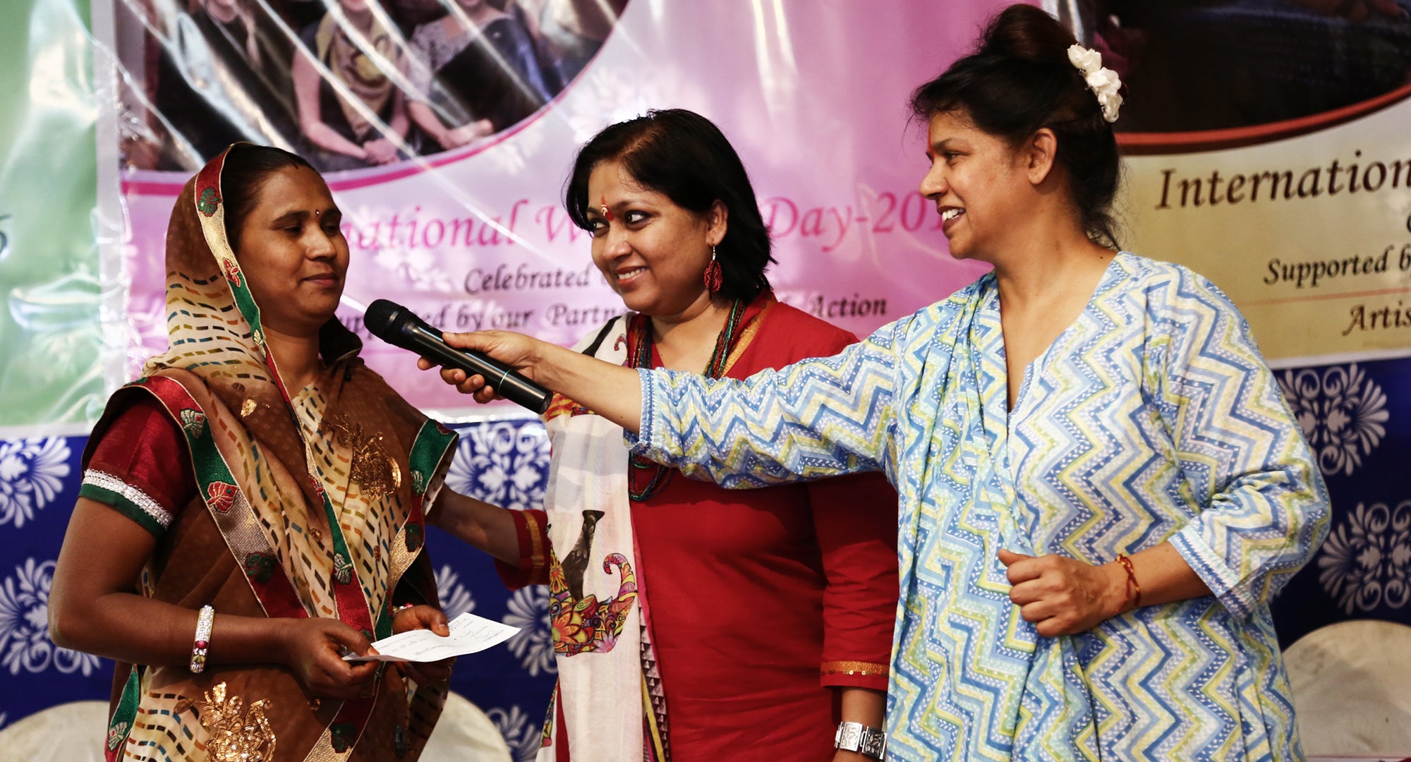 Lakshmi accepting  her award on International Women's Day
