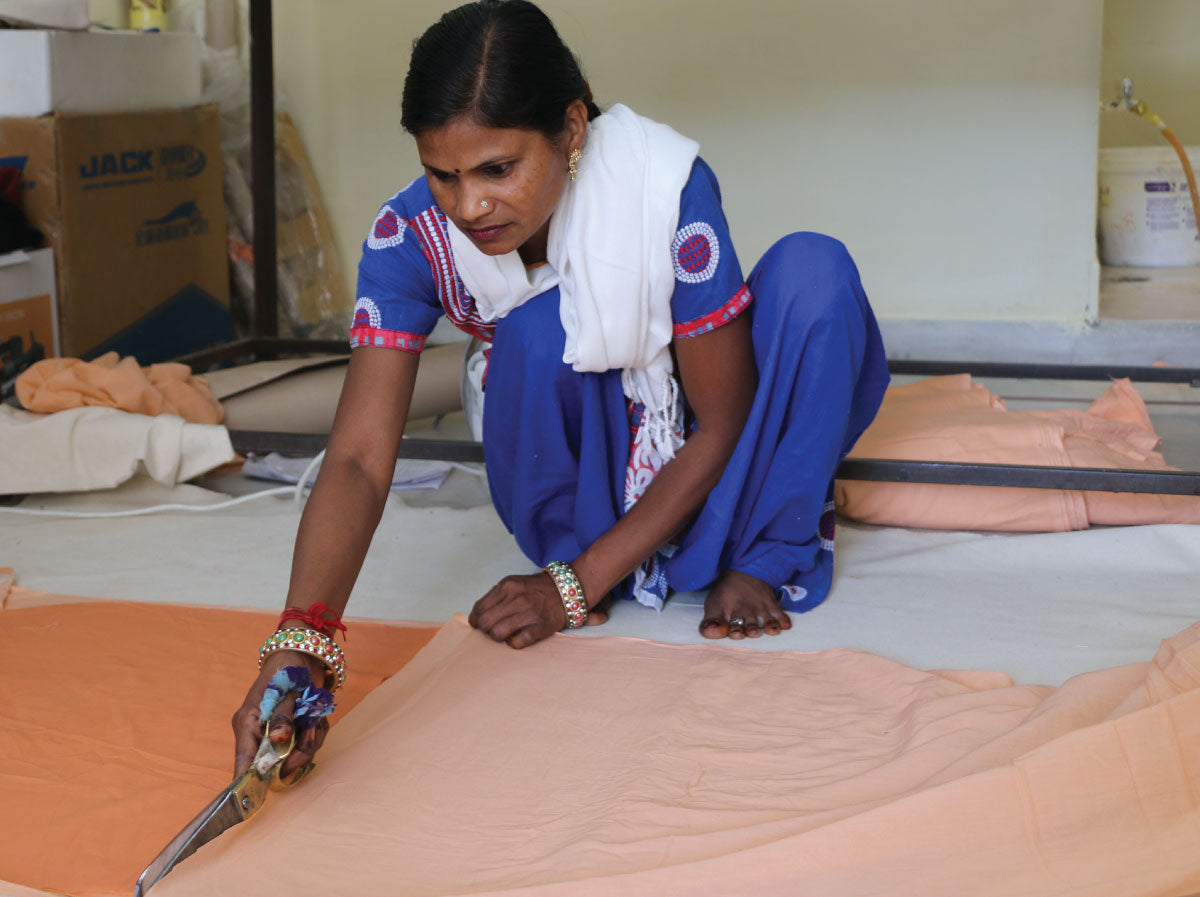 Shakuntela cutting fabric in 2018