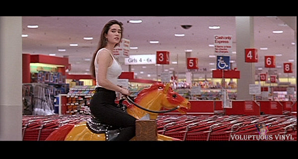 Jennifer Connelly riding a mechanical horse