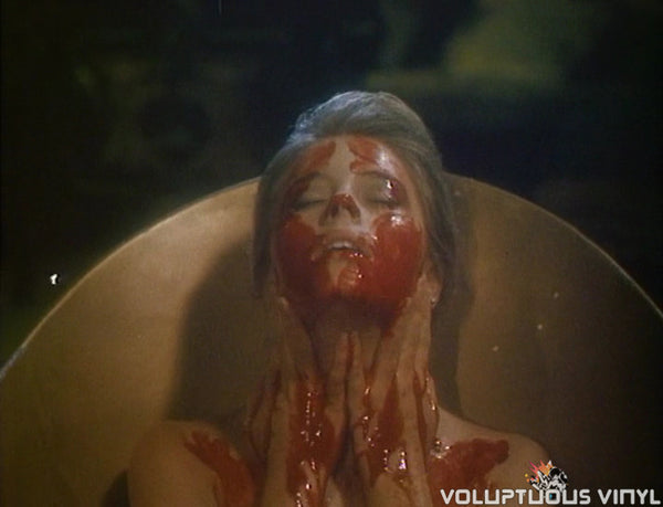 Nicole Eggert bathing in blood in The Haunting of Morella