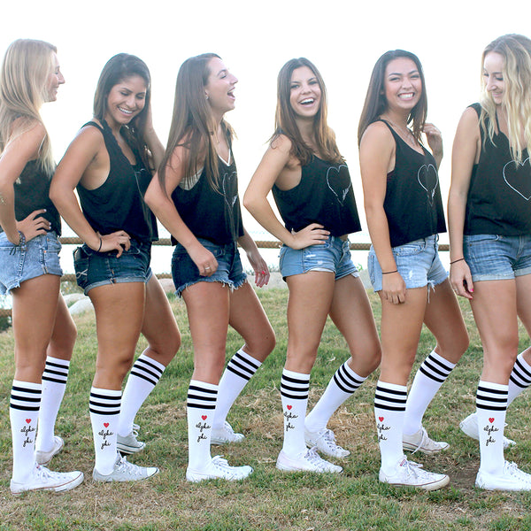 This is an image of a group of girls posing and wearing the sorority Alpha Phi knee high custom printed socks.