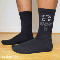 This is an image of customized "If You Got It Haunt It" black crew socks.