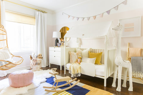 A little girl's bedroom makeover designed by Brady Tolbert - Striped Pillows by Jillian Rene Decor