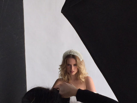 Jenny Guttridge being photographed in The Season Hats bridal hairband