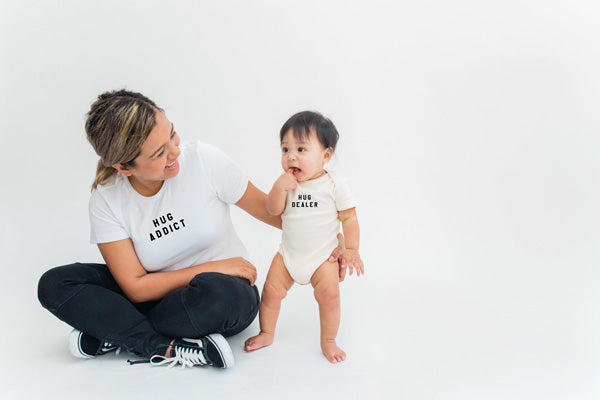 'hug addict' women's tee, 'hug dealer' baby onesie