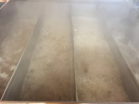 Maple syrup boiling in our front pan.