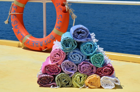 Colourful Sorbet holiday beach towels on deck