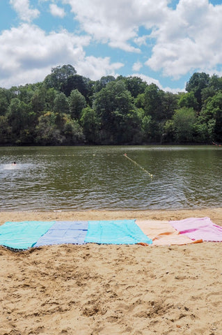 Sorbet hammam towels laid out on the sand