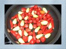 Ghost Peppers with Chicago Sports Peppers and Garlic fried with Olive oil. Mmmm....what a topping on your favorite Chili recipes