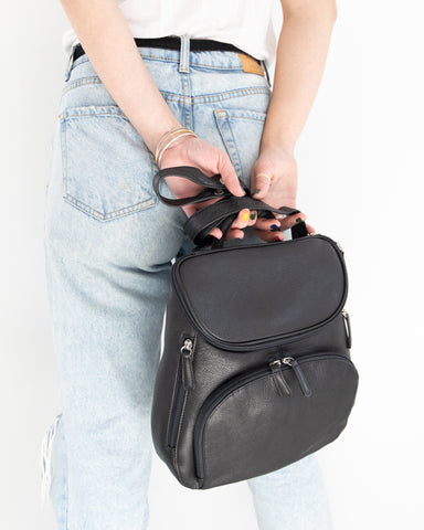 model holding creel backpack in black