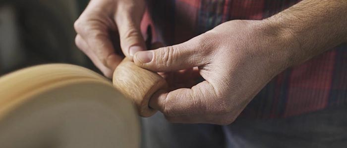 Jesse O'hara sanding a handcrafted pipe