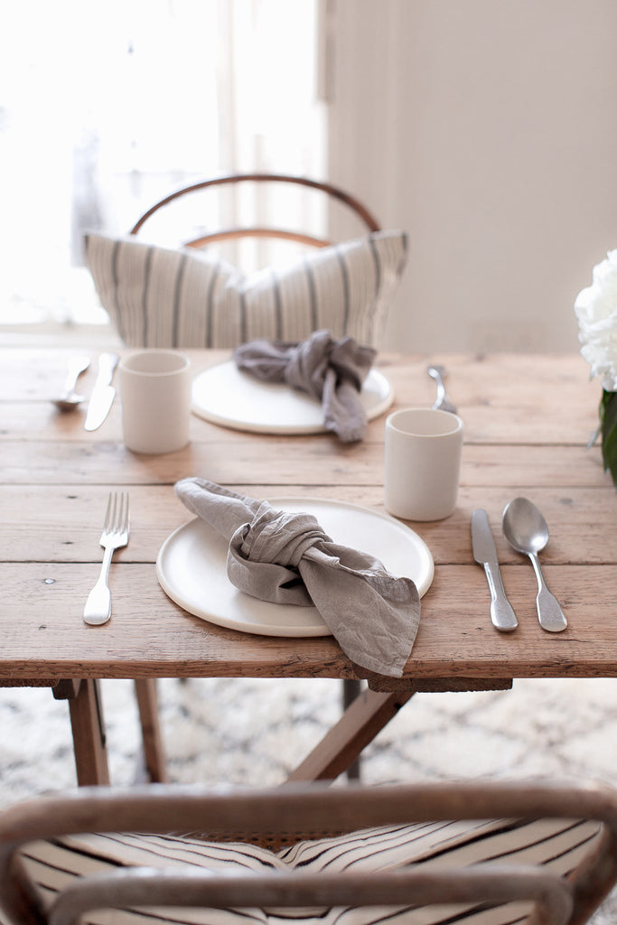 Simple tablescape with wood, linen and flowers