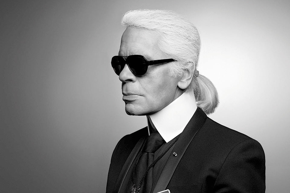 Karl lagerfeld portrait shooting in black tie and iconic white shirt