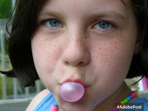 girl blowing bubble