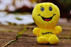 yellow little cuddly toy smiling no strain or worry in him
