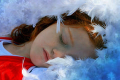 Child Sleeping in feather bed