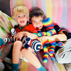 Two boys with their brightly coloured Red Rufus SockDogs