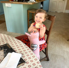 Little girl with personalised Red Rufus SockDog in pink